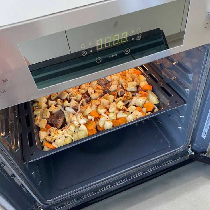 Horno empotrable Candy con anafe a gas integrado en acero inoxidable