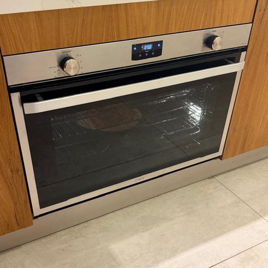 Horno eléctrico Italiano Candy 90 cm ELIOE91MF-12 foto de frente cocinando