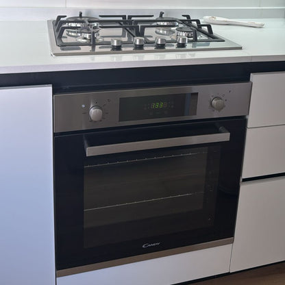 Horno empotrable Candy con anafe a gas integrado en acero inoxidable